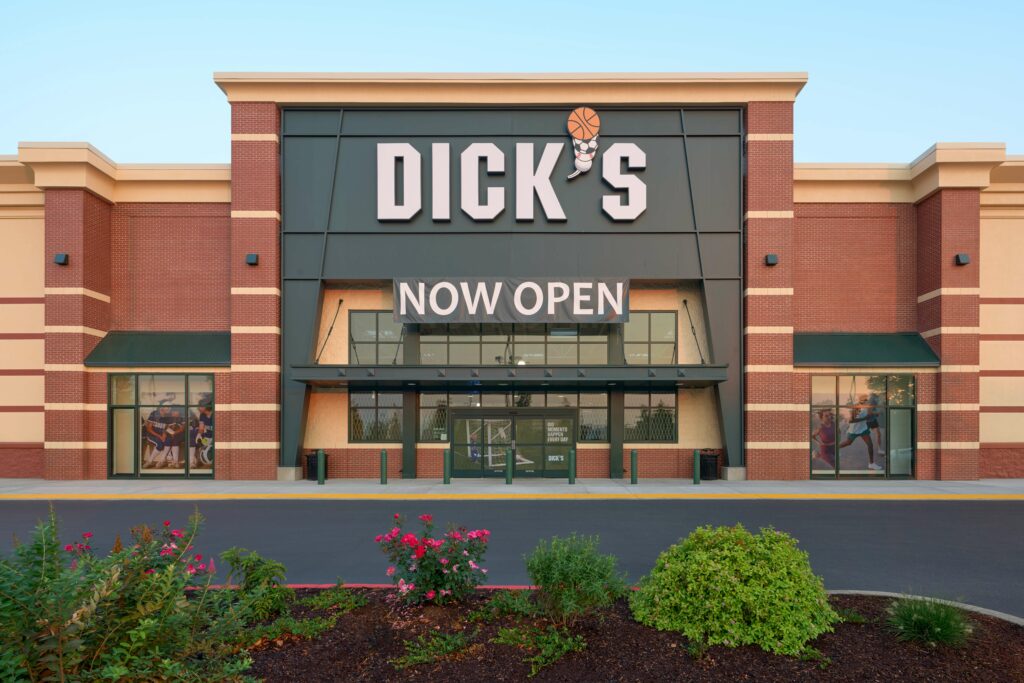 Dick's Sporting Goods store with a 'Now Open' sign on the front.