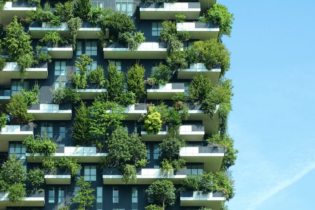 Modern building with trees on balconies