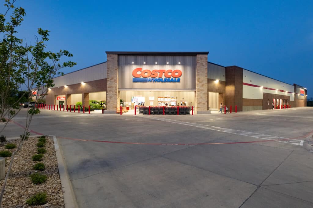 Exterior view of a Costco Wholesale store at dusk
